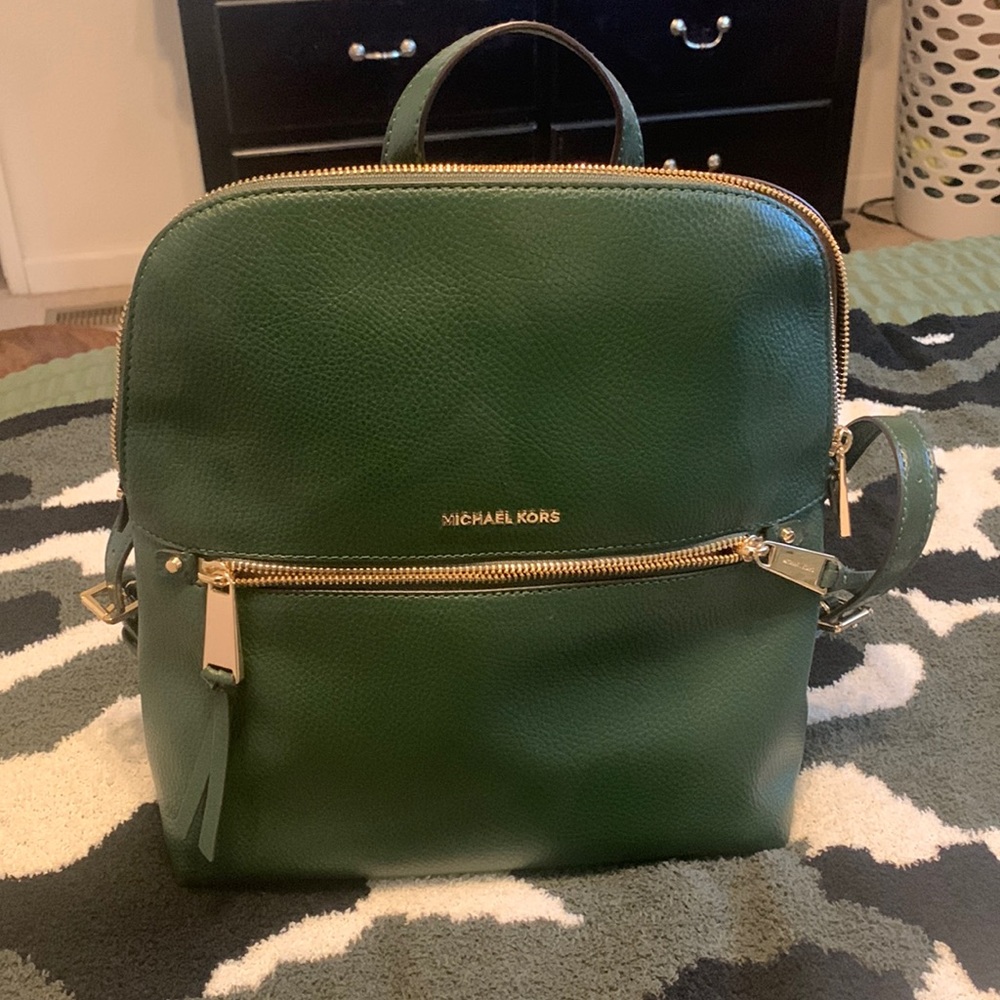 Michael Kors green backpack. Very lightly used. No stains or rips.